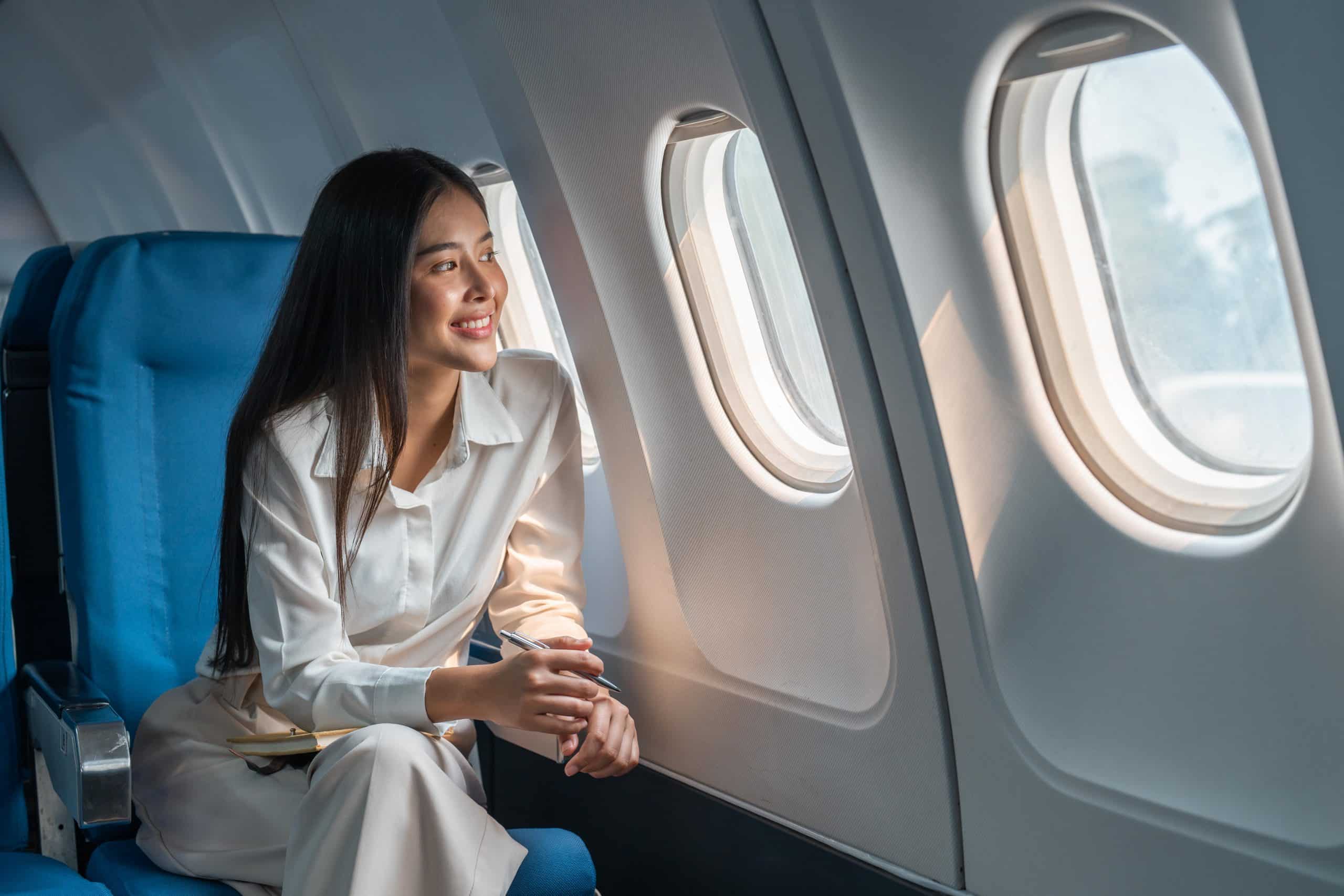 Woman excited to be on an airplane 