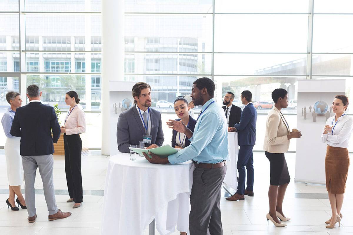 Business professionals discuss potential collaboration opportunities to form a mutually beneficial loyalty ecosystem.