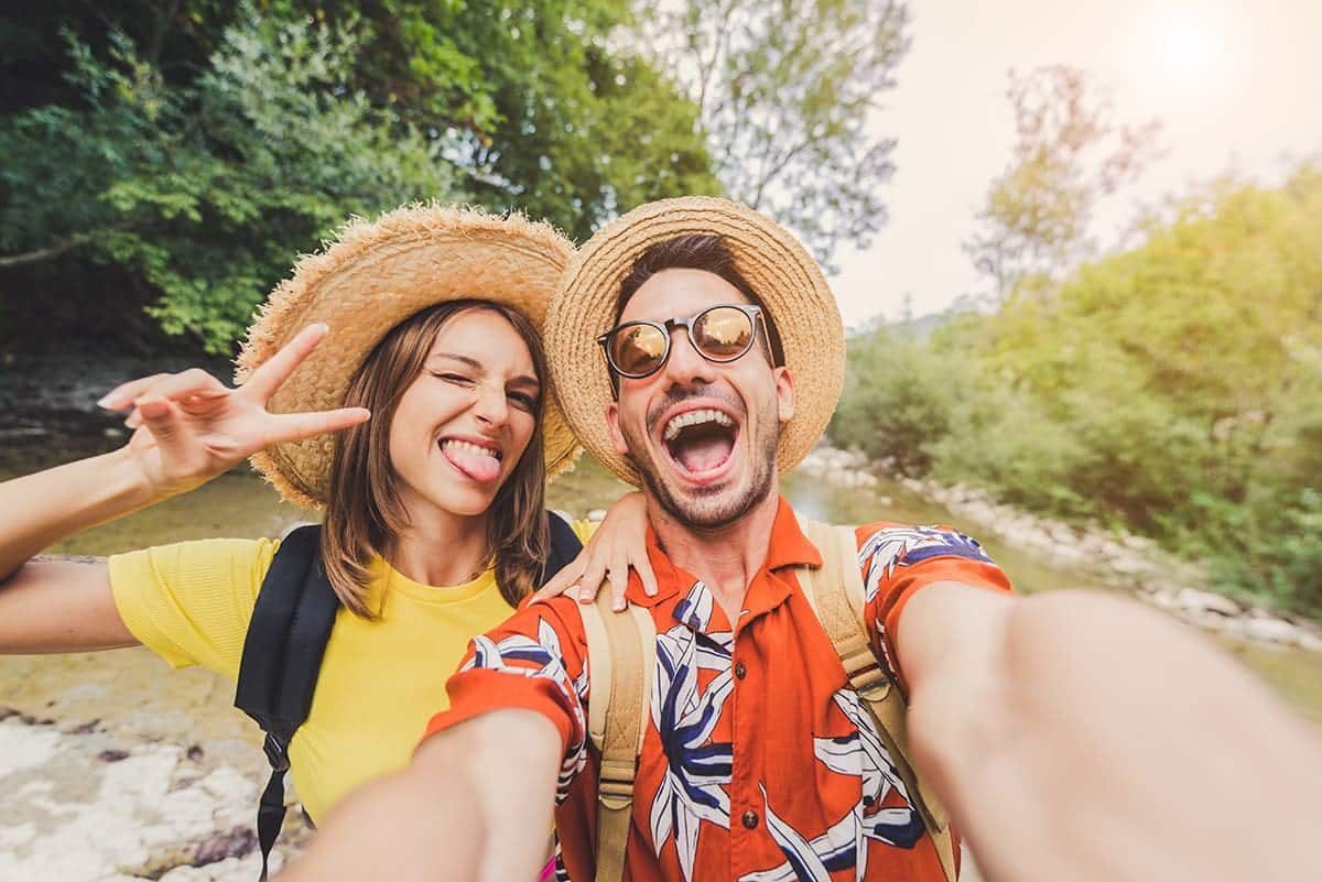 Couple traveling and engaging with the travel loyalty program membership perks.