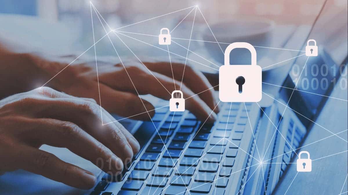 Hand typing on a keyboard working with screen analyzing blockchain in loyalty programs.